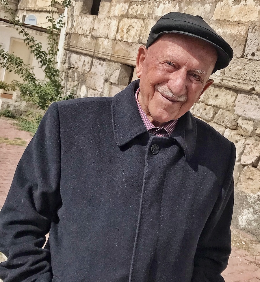 old man with black cap