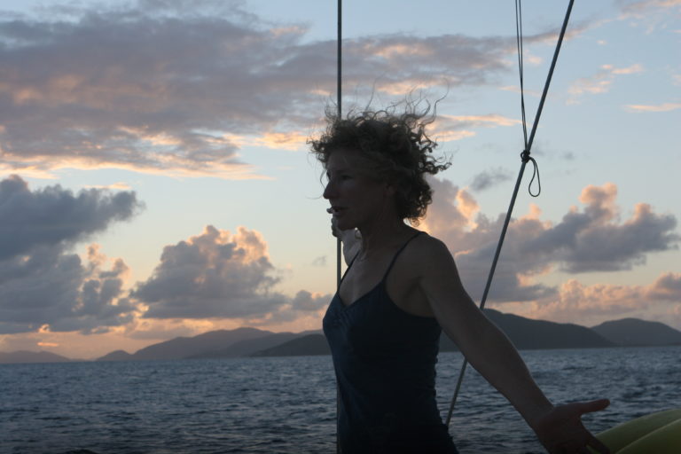 An amazing empty nest memory of me in silhouette on a boat at sunset