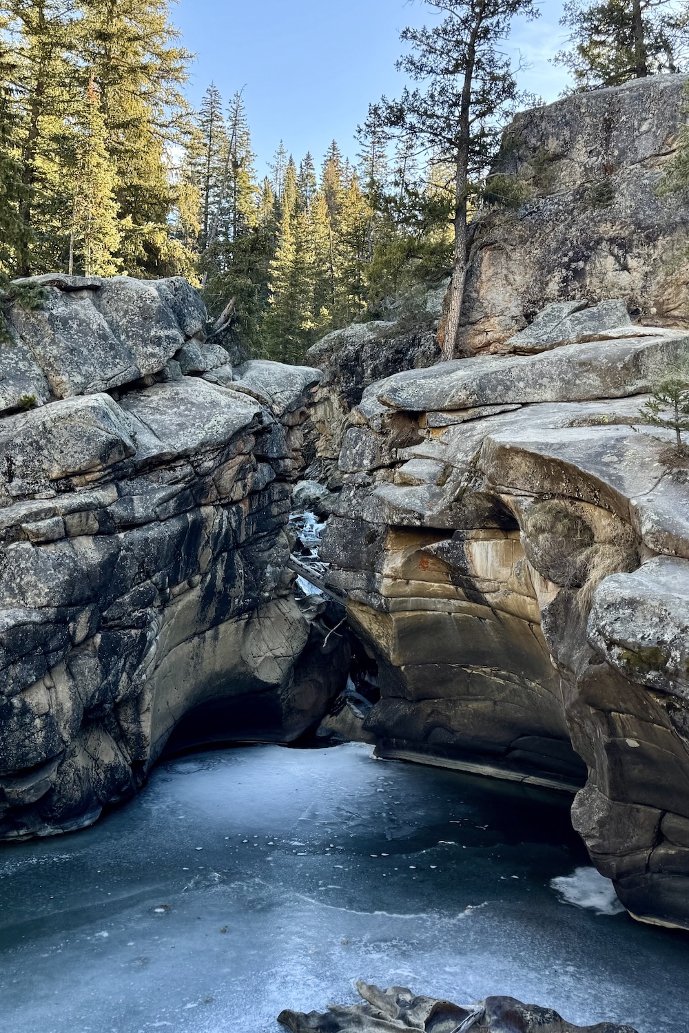 Rock Cliffs above frozen water