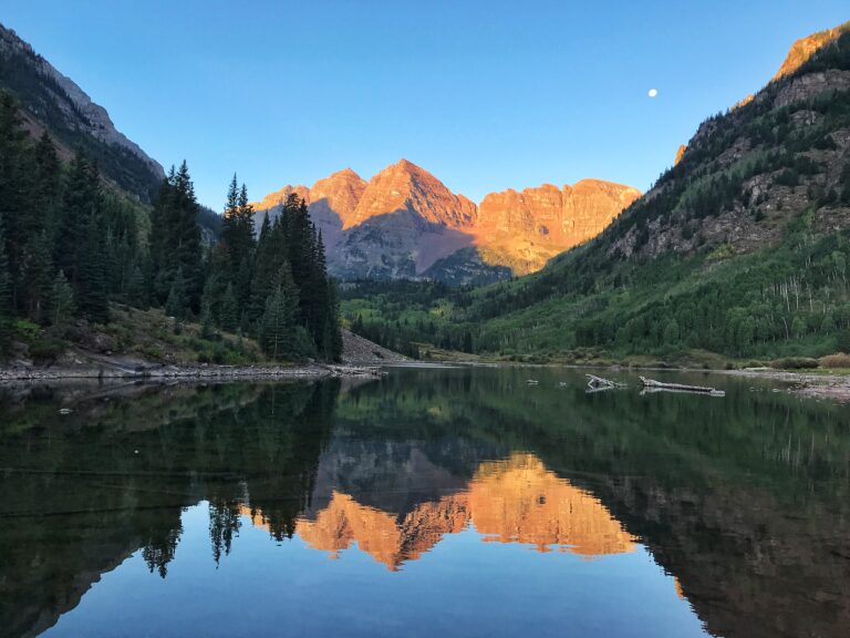 Sunrise on the mountains with reflection on lake