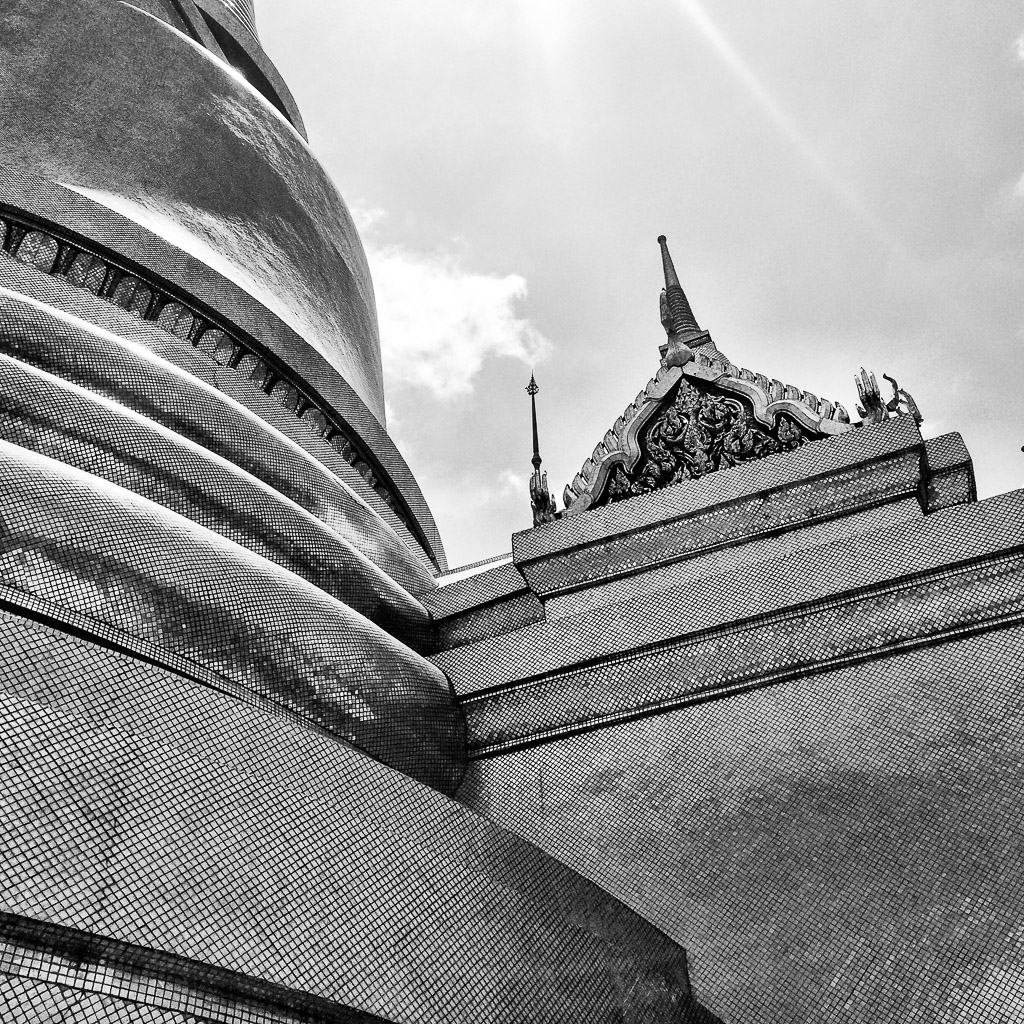 Close up of the bell shaped golden stupa on the grounds of the Grand Palace in Bangkok