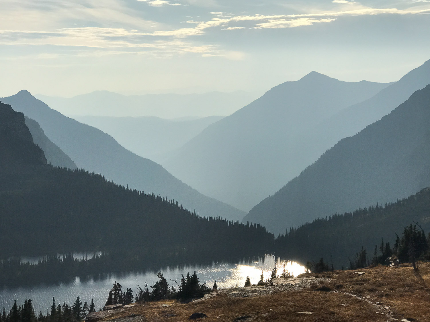 Mountain silhouette view over Hidden Lake in Glacier National Park