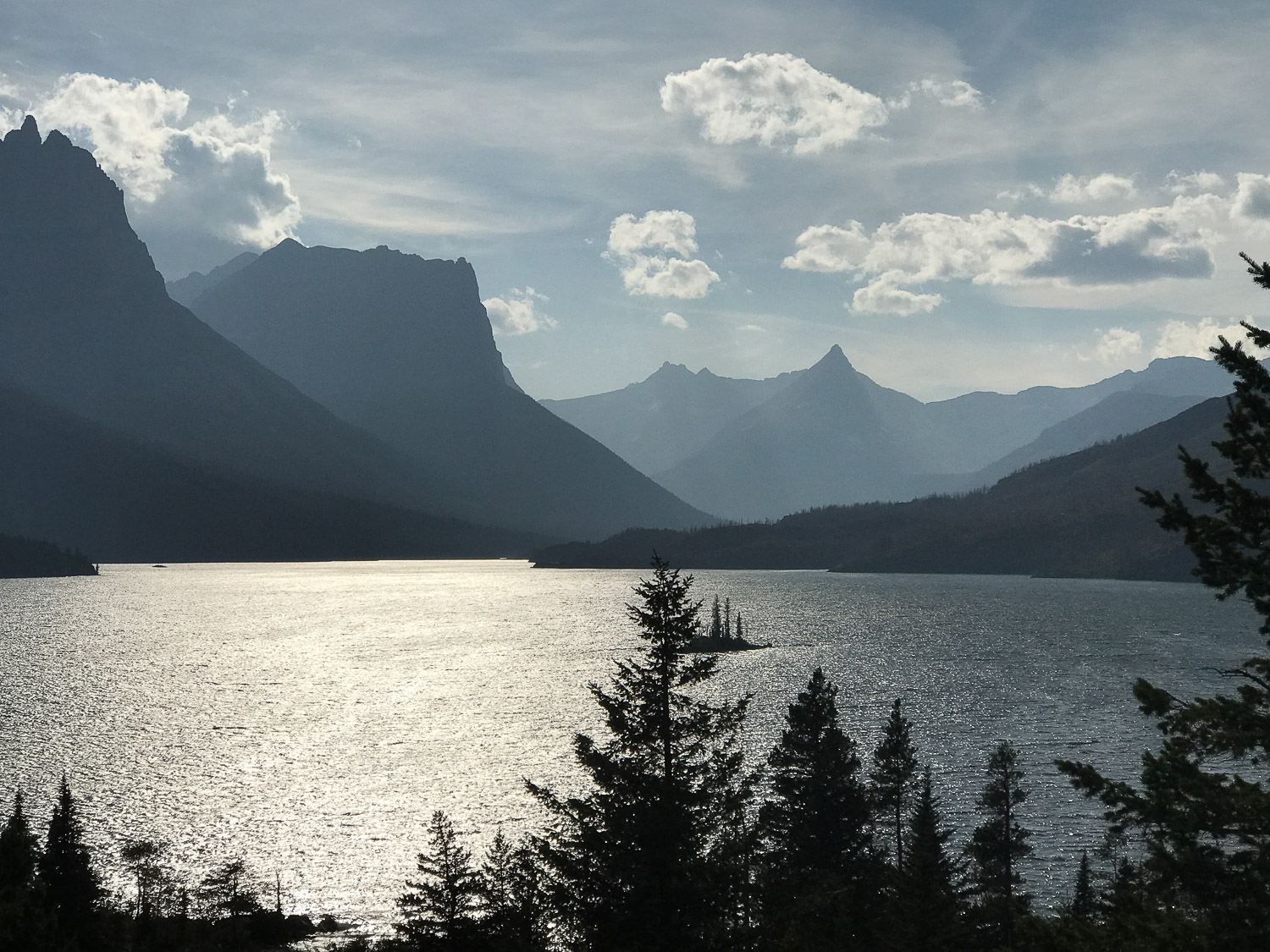 Wild Goose Island Viewpoint offers splendid, panoramic views of the magnificent peaks encircling Saint Mary Lake with tiny Wild Goose Island in the middle