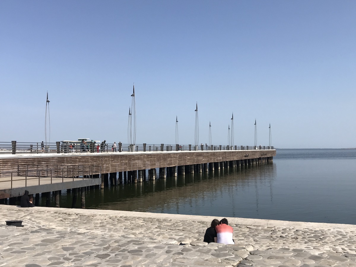 couple sitting by the sea in Azerbaijan