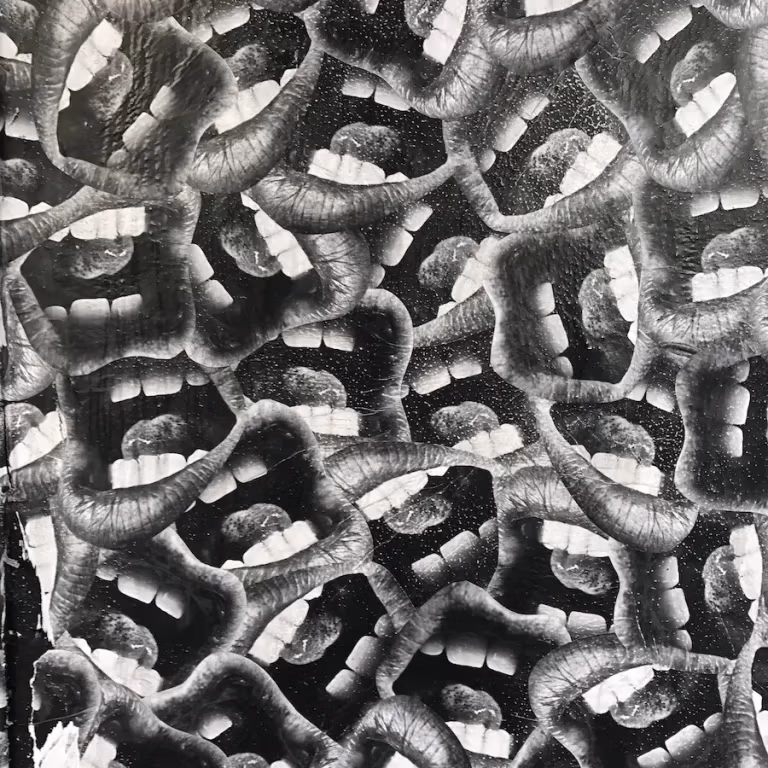 Black and white mural of mouths in Athens