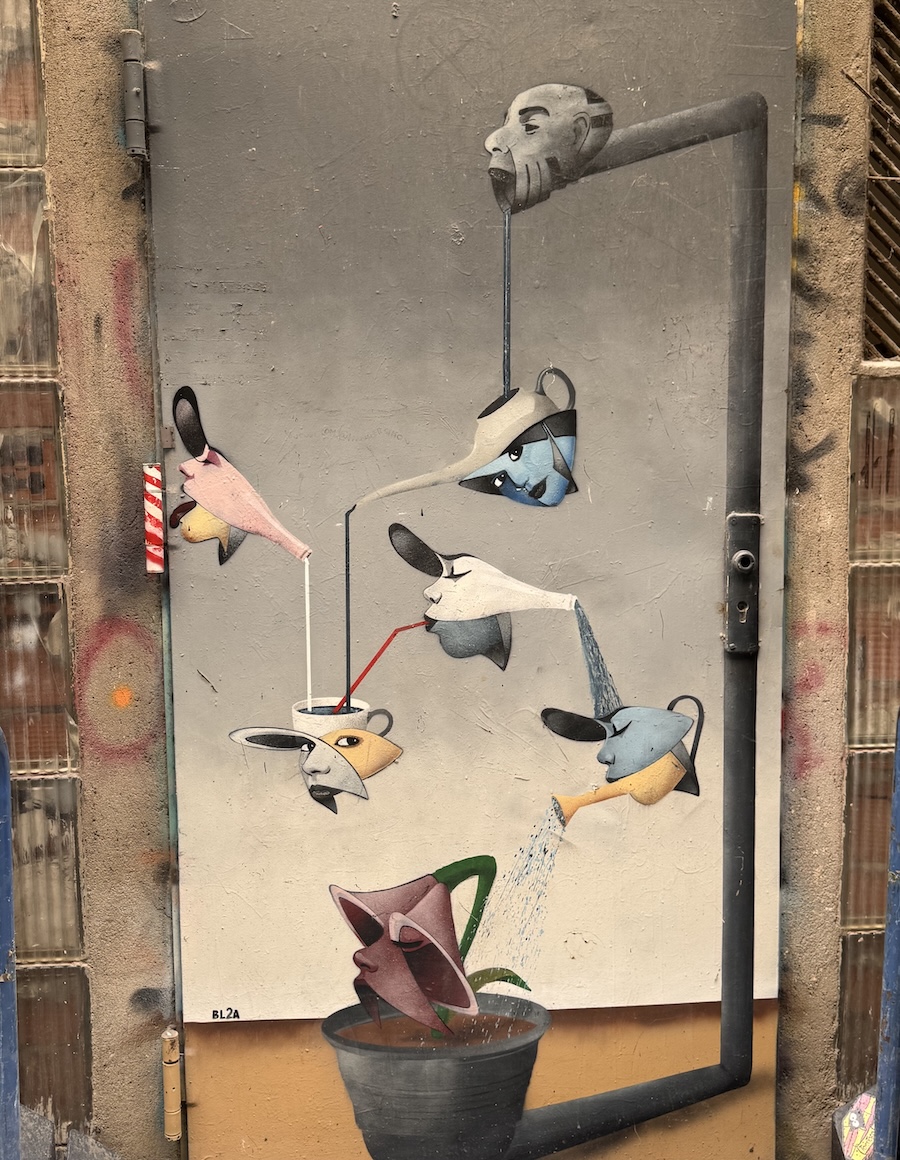 A surrealistic hanging art mural in Barcelona