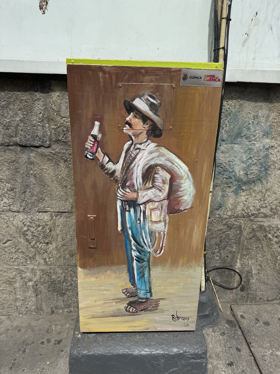 Hand-painted portrait of a local Cuenca character on a metal utility box by Roberto Bravo in Cuenca, Ecuador
