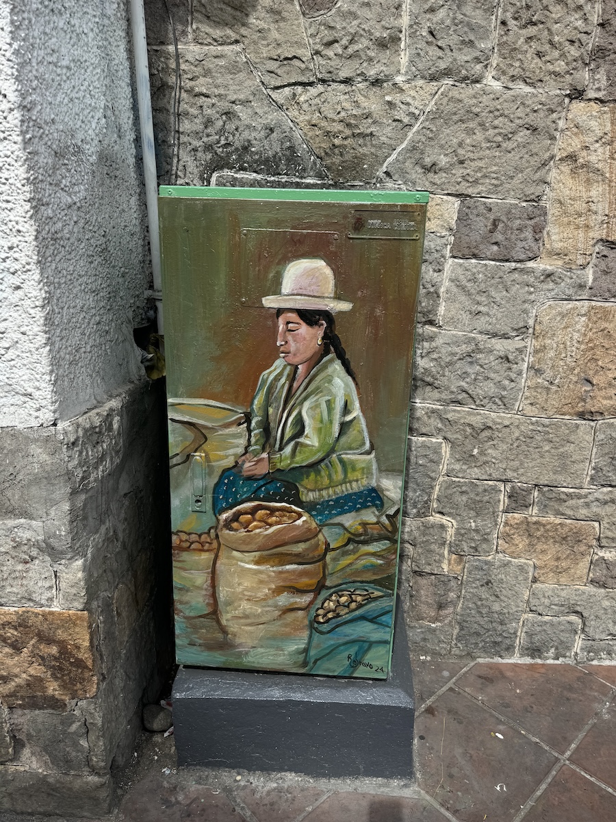 Hand-painted portrait of a local Cuenca character on a metal utility box by Roberto Bravo in Cuenca, Ecuador