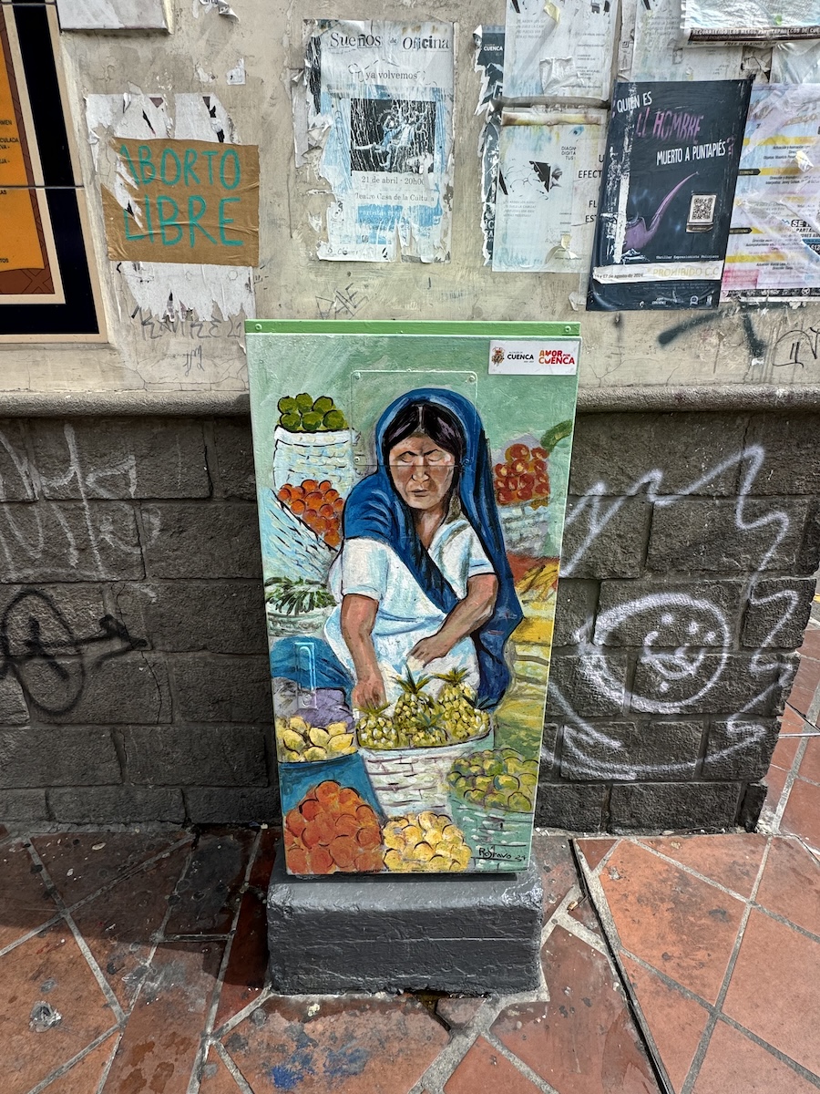 Hand-painted portrait of a local Cuenca character on a metal utility box by Roberto Bravo in Cuenca, Ecuador