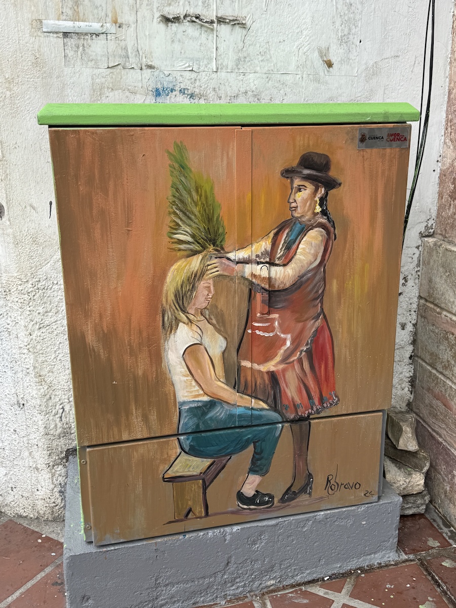 Hand-painted portrait of a local Cuenca character on a metal utility box by Roberto Bravo in Cuenca, Ecuador