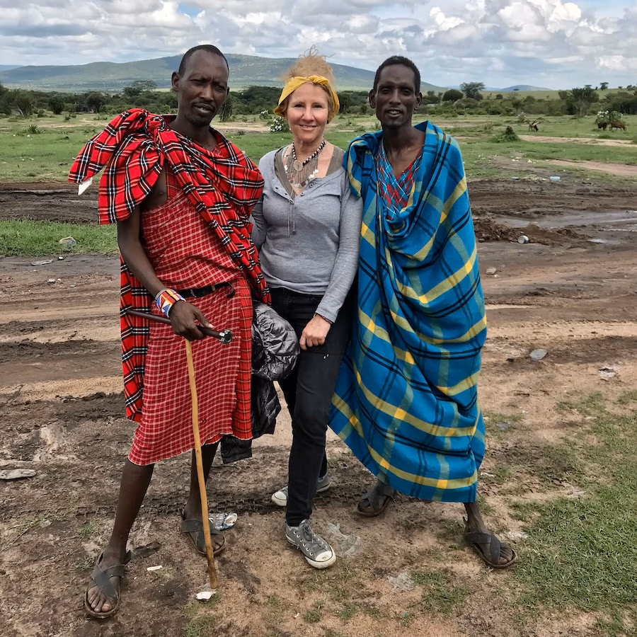 Woman flanks by two Maasai Warriors