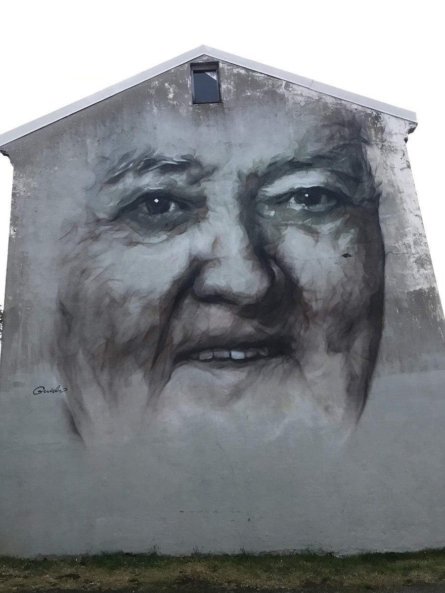 old womans face on wall