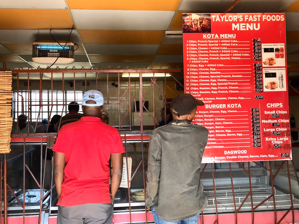 Two men order food at Taylor's Fast Foods