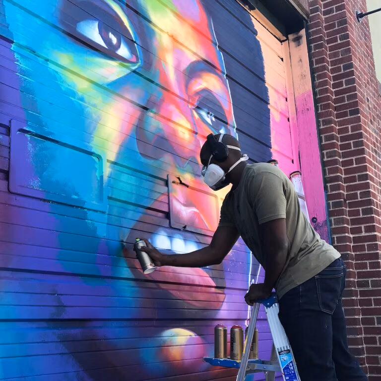 Detour paining a colorful portrait of Nina Simone for Crush Walls 2018