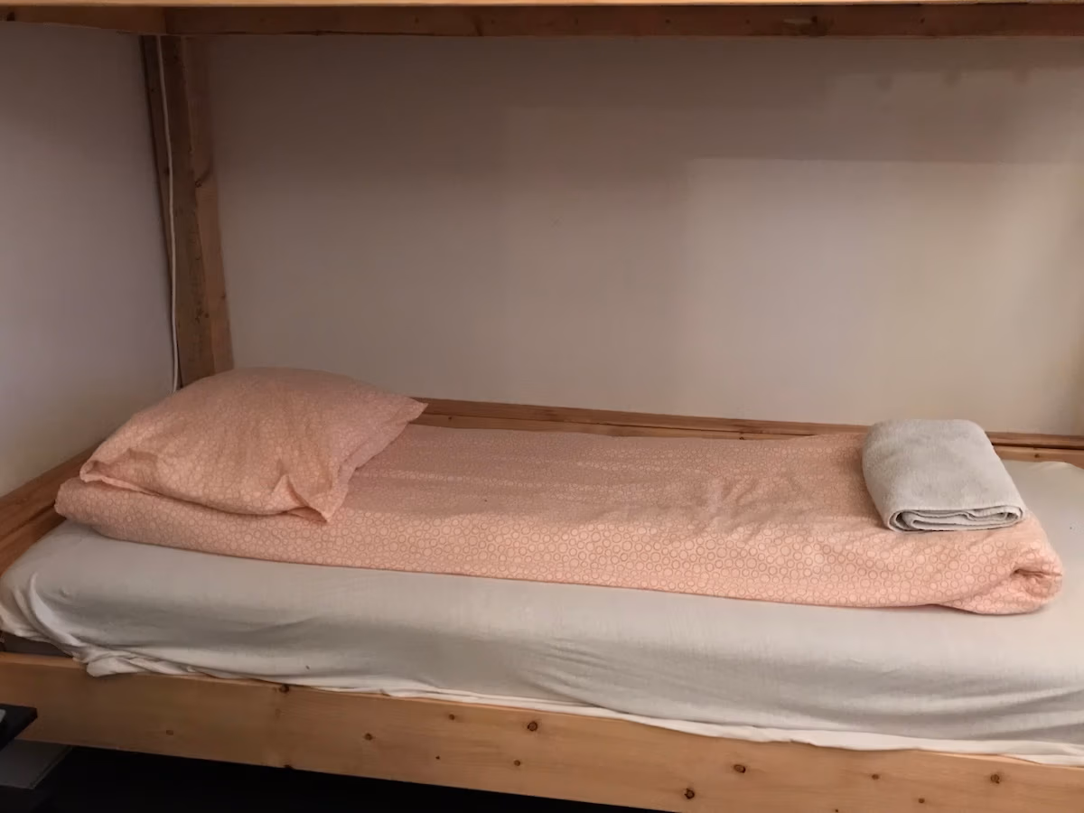 Pillow and blanket in a bunk bed