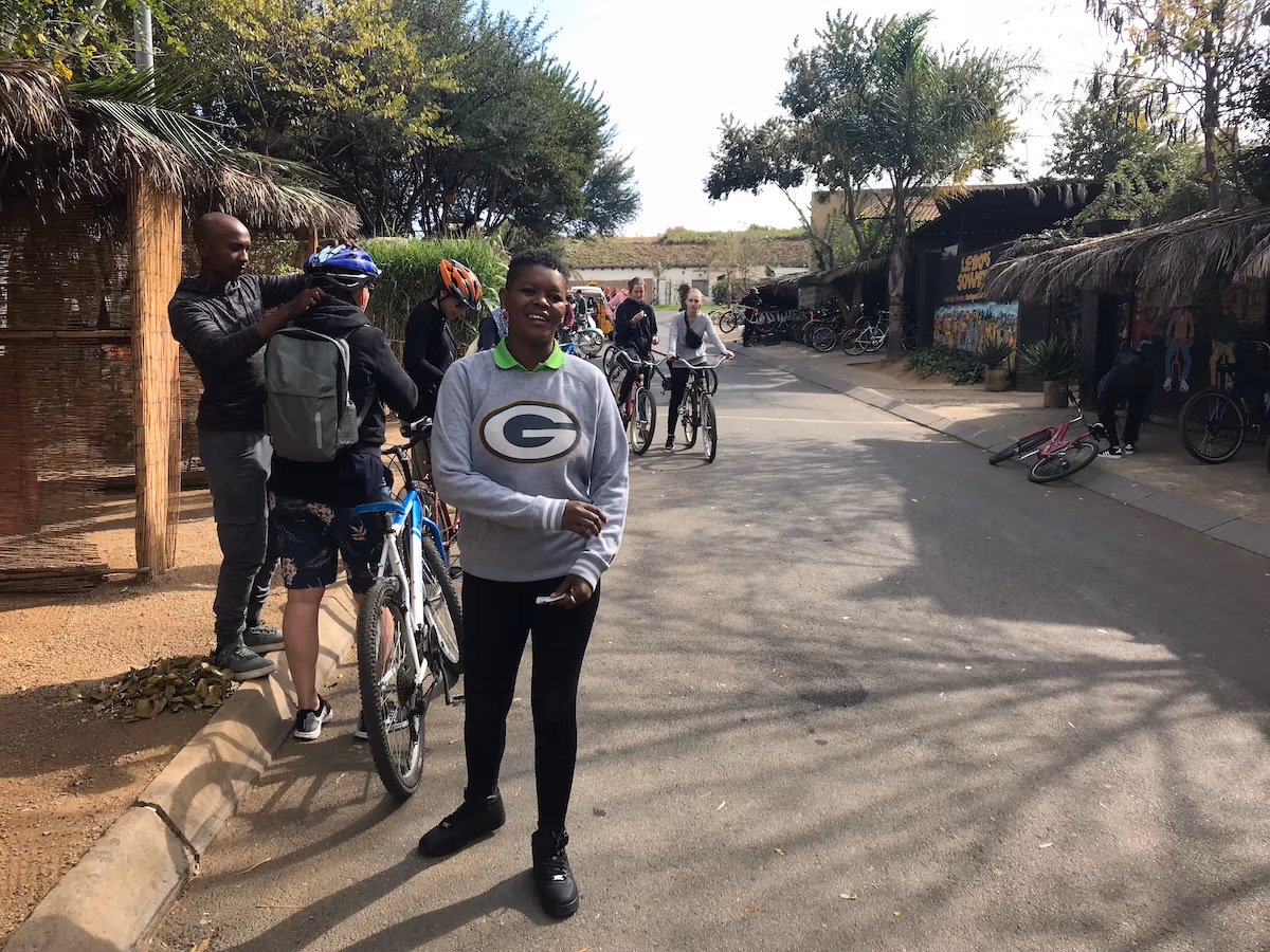 street view of bicyclers with tour leader facing camera