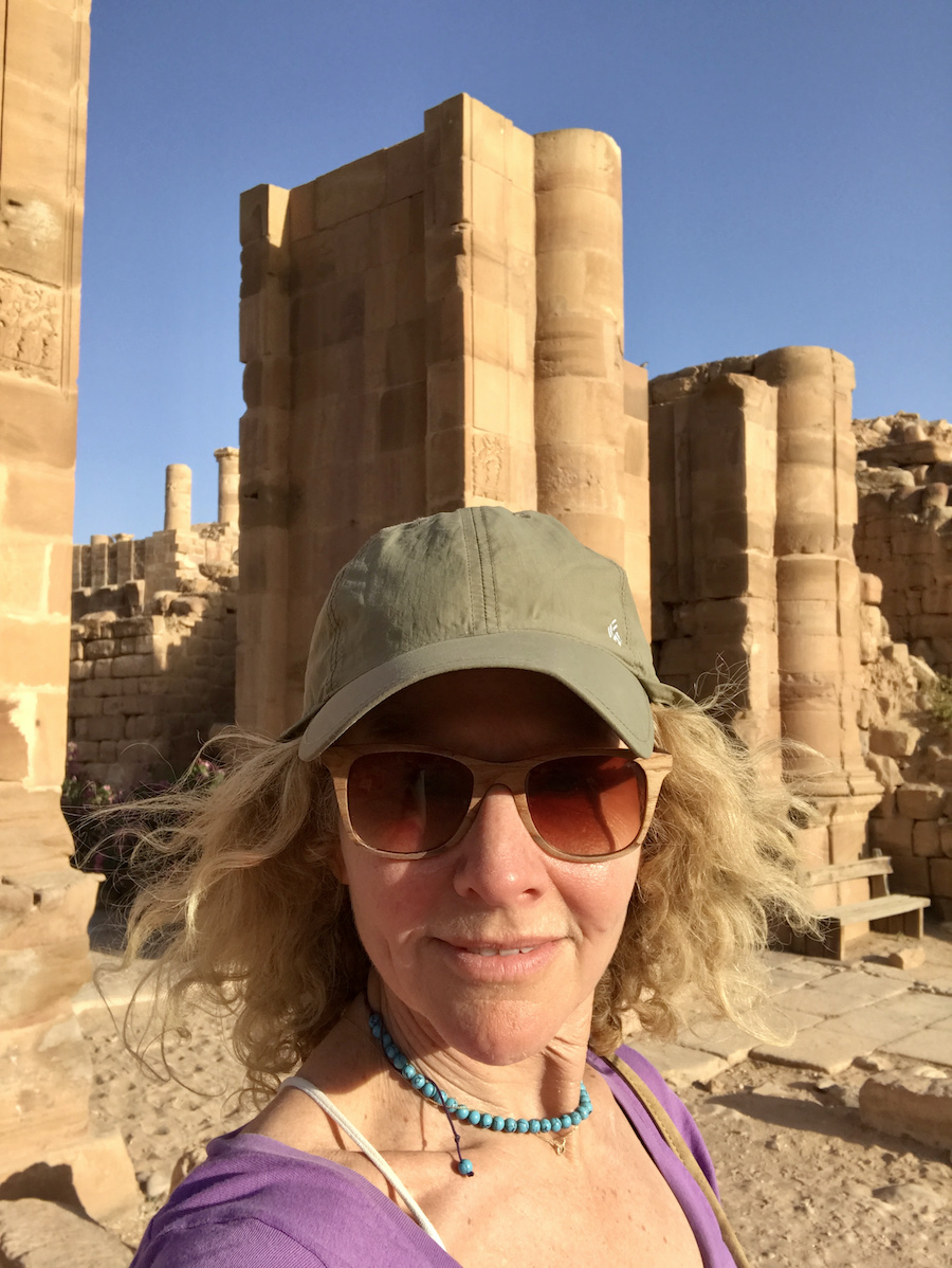 lady in front of ruins