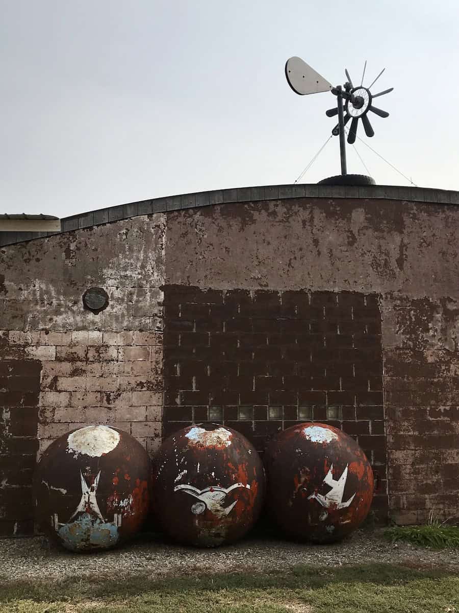 three large metal ball sculptures
