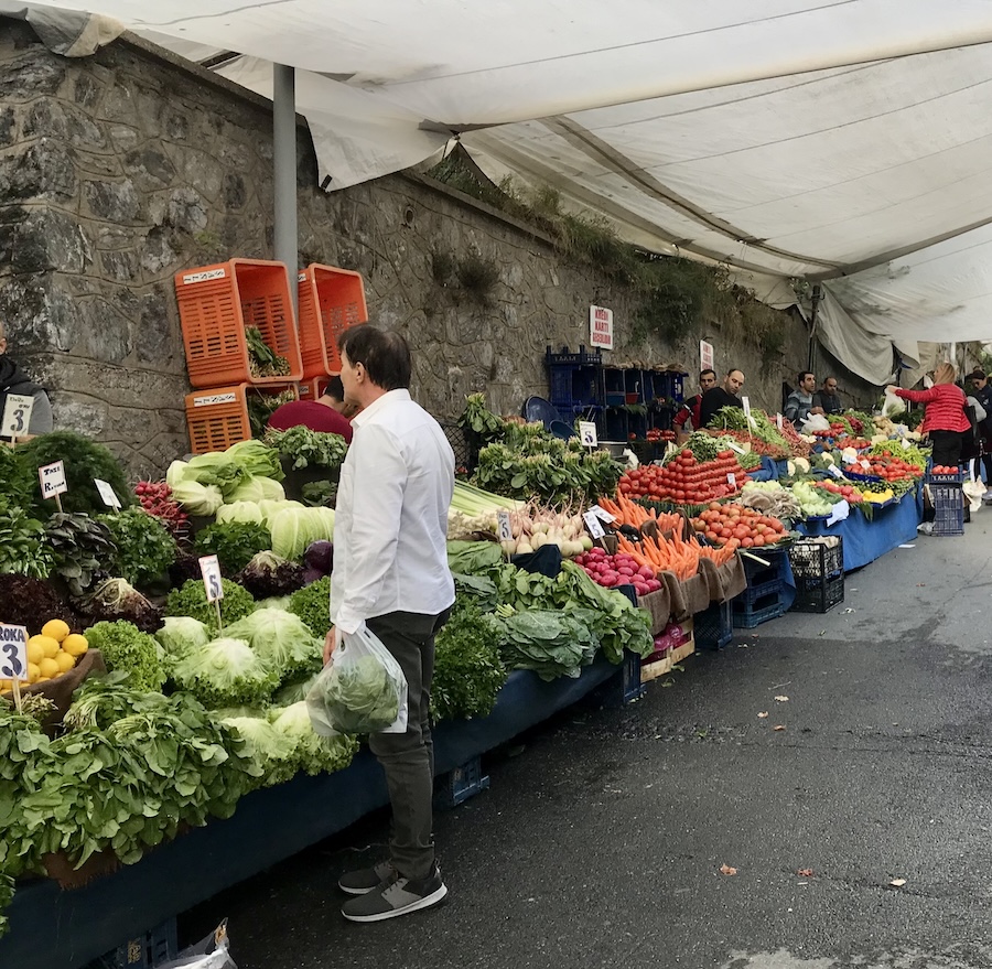 Man buying fresh produce at an open air market in Istanbul