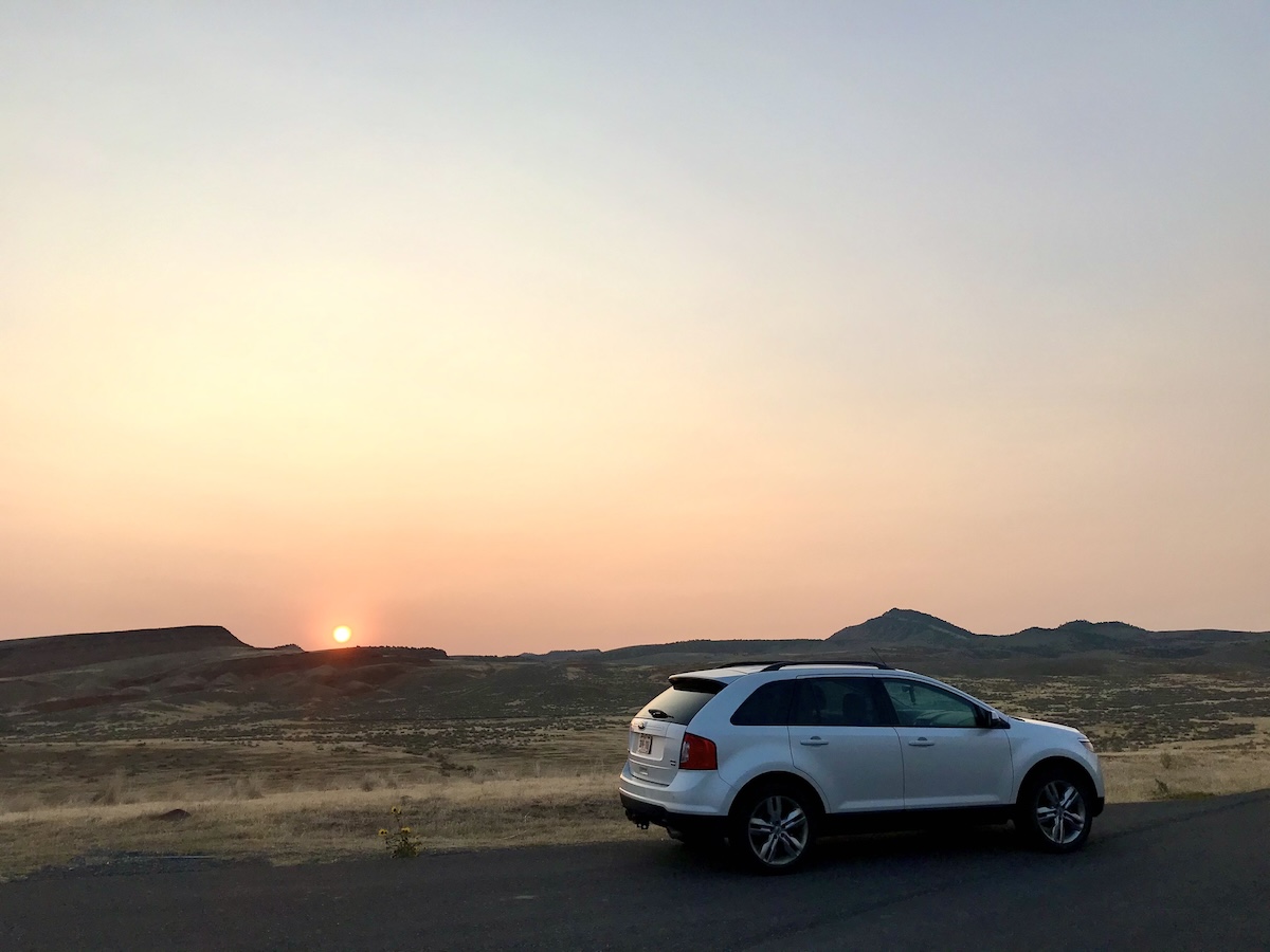 Sunrise and vehicle in foreground