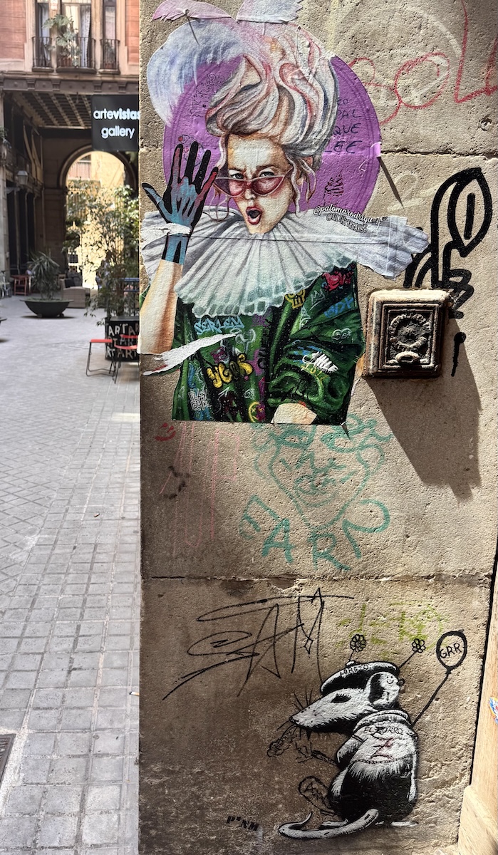 A female clown and a mouse street art in Barcelona
