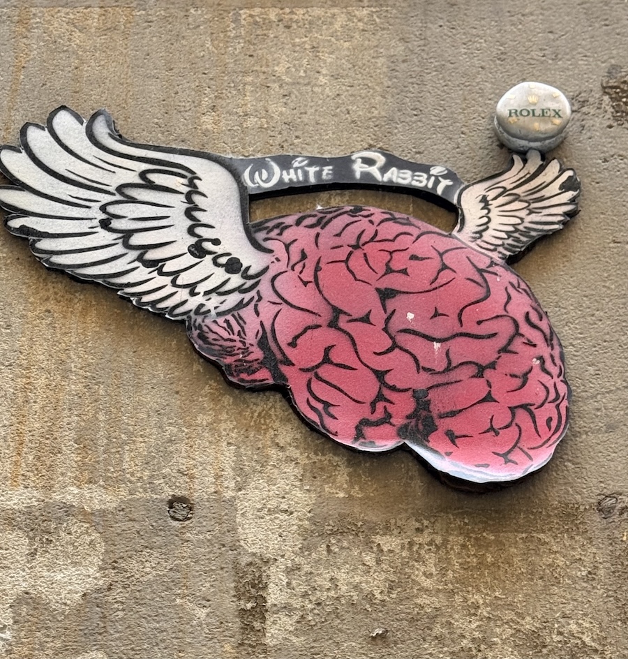 A flying heart stencile on a wall in Barcelona