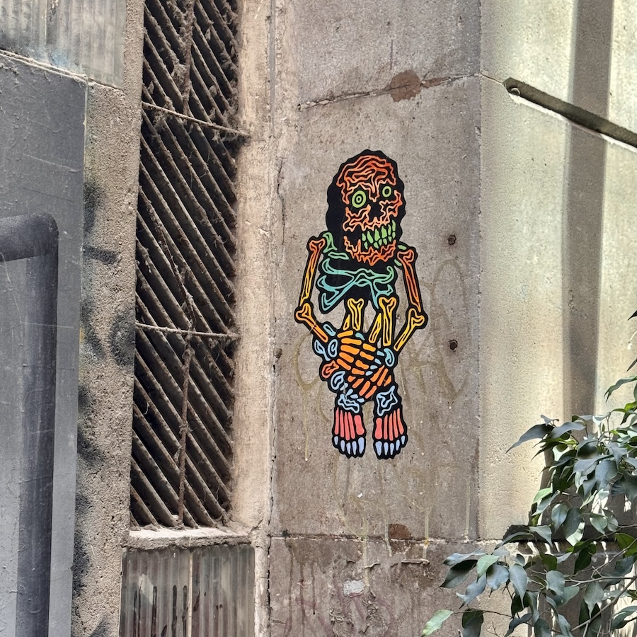 A colorful skeleton street art in Barcelona