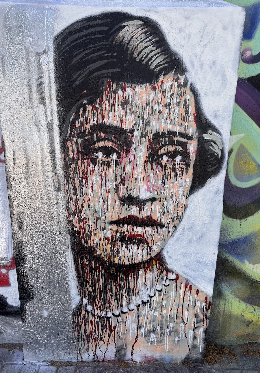 Barcelona street art of girl with paint splatter