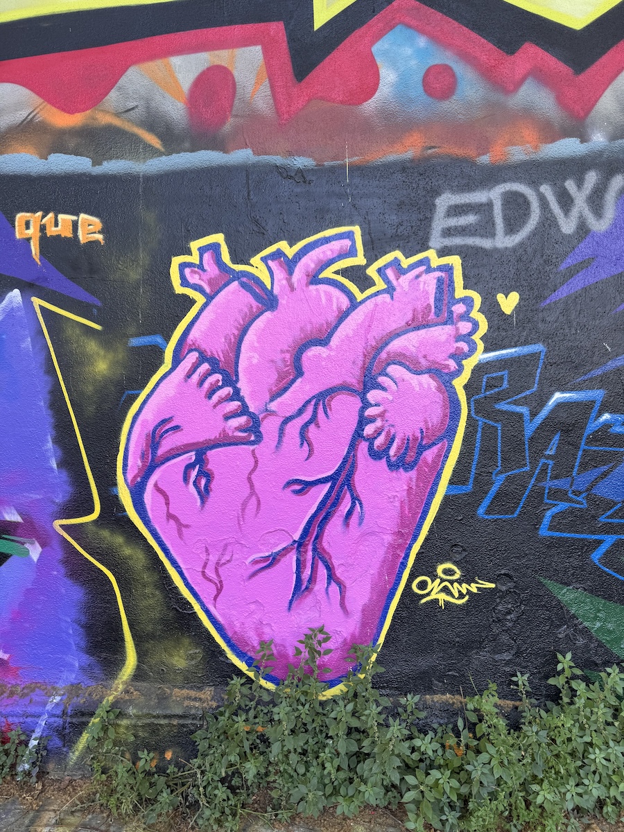 A pink heart paste up on a Barcelona wall