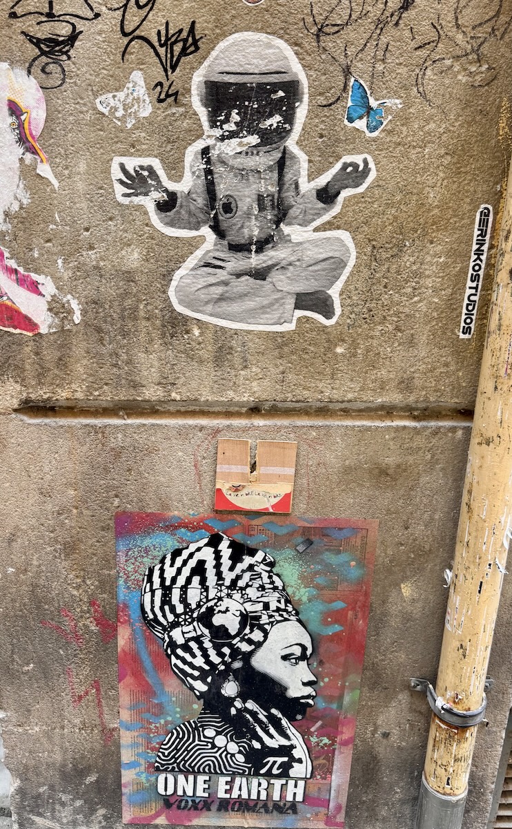 A spaceman and an African woman street art in Barcelona