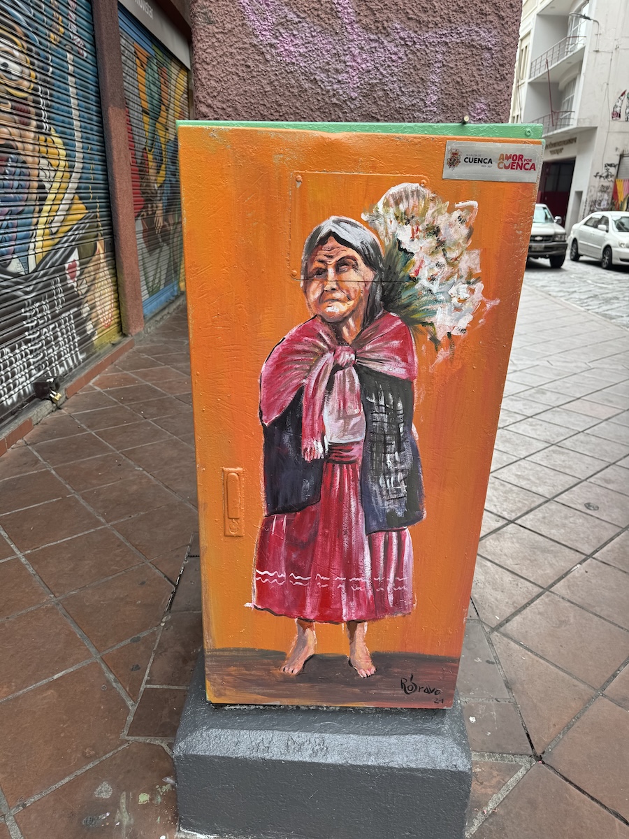 Hand-painted portrait of a local Cuenca character on a metal utility box by Roberto Bravo in Cuenca, Ecuador