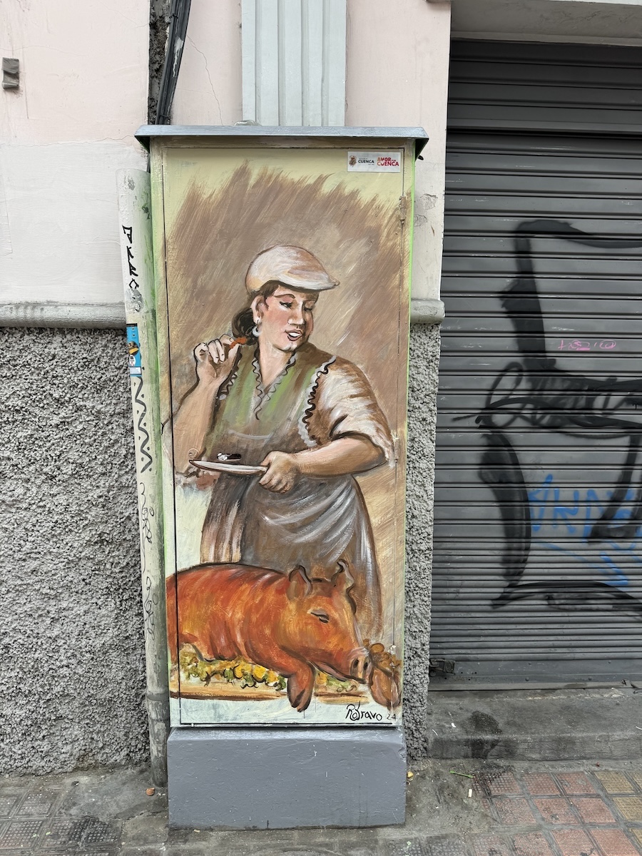 Hand-painted portrait of a local Cuenca character on a metal utility box by Roberto Bravo in Cuenca, Ecuador