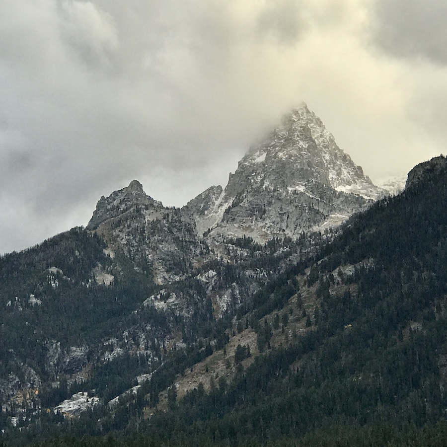 The Grand Tetons covered with light snow