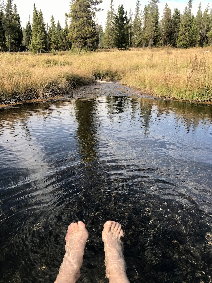 Two feet floating in a hot springs