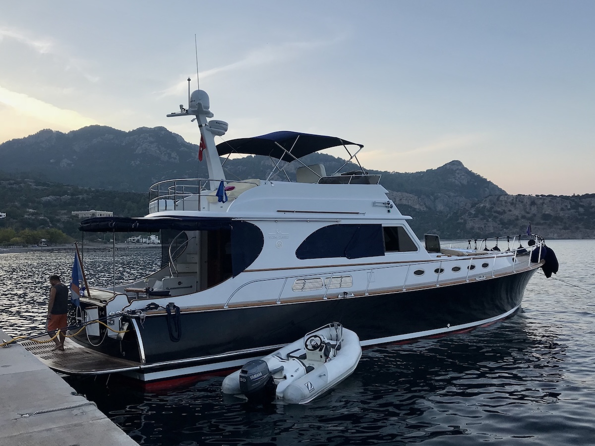A soletary boat docked in Amos Bay, Türkiye