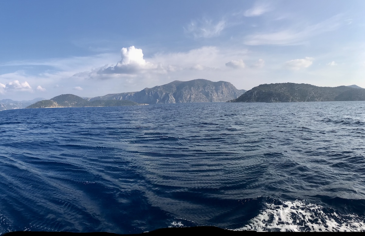 The vast ocean with distant mountains