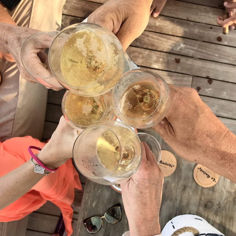 Top view of champagne glasses clinking cheers