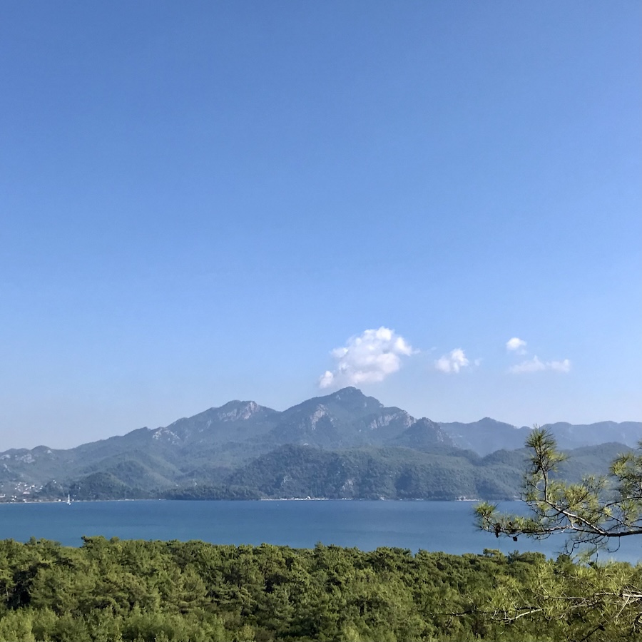 The view of the ocean with a distant mountain