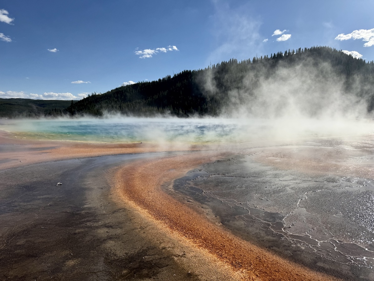 Rust rings, aqua pools and steam rising at the Prismatic Geyser in Yellowstone