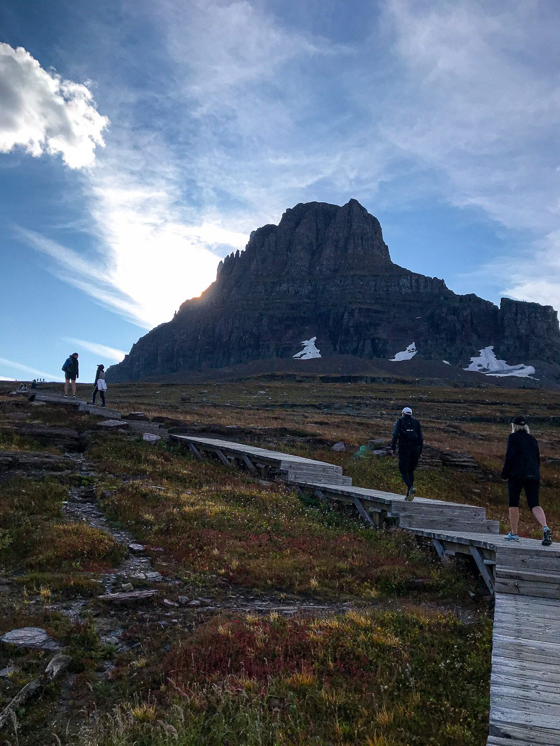 Walking the wooden boardwalk up to the Hidden Lake Overlook in Glacier National Park